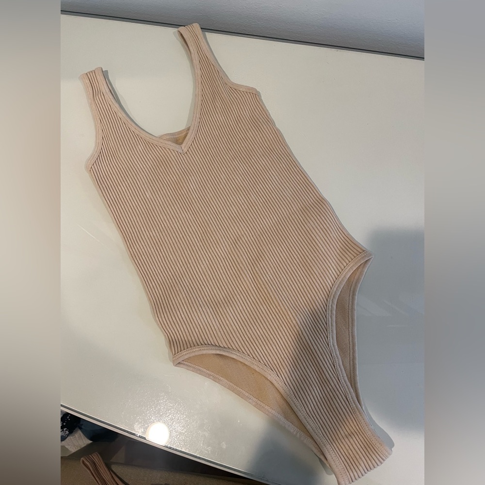 Cream ish pink ish body suit